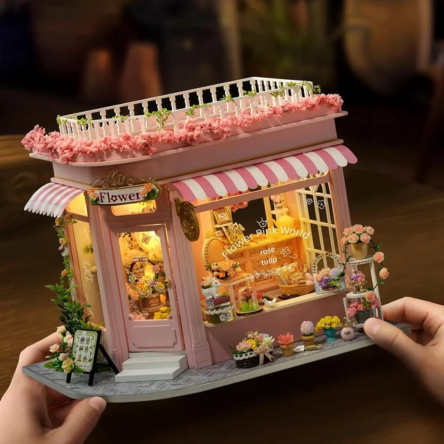 CUTEROOM Colorful Flower Shop held in a hand with the lights on